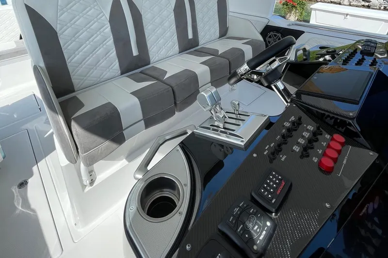 Slide: The Image of 2019 Cigarette 41' GTR boat cockpit with modern controls and stylish seating. - 16