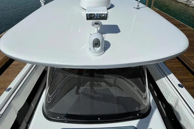 Slide: The Image of 2019 Cigarette 41' GTR boat with sleek white design and advanced navigation equipment. - 17