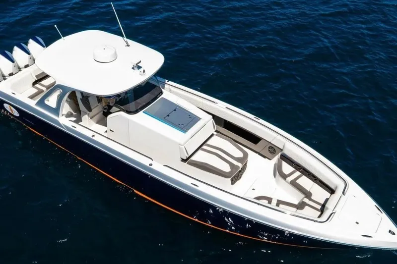 Slide: The Image of 2019 Cigarette 41' GTR boat on open water, featuring sleek design and powerful engines. - 2