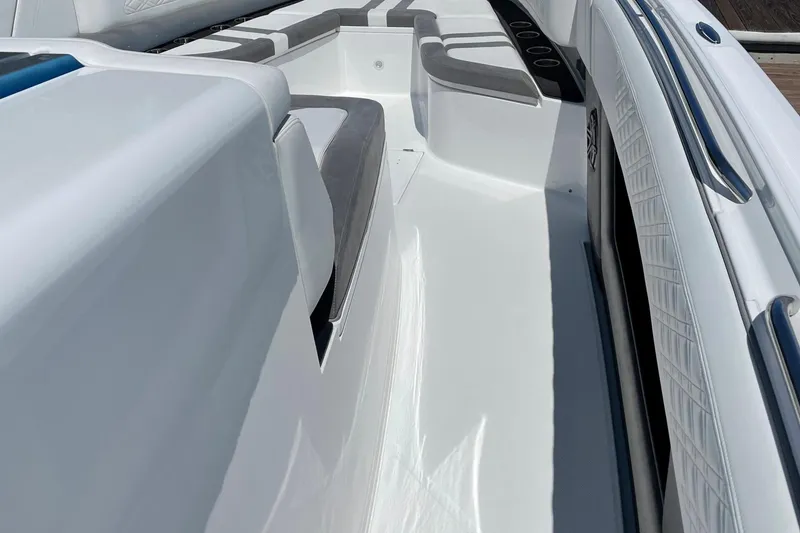 Slide: The Image of 2019 Cigarette 41' GTR boat interior with sleek white and gray seating. - 22