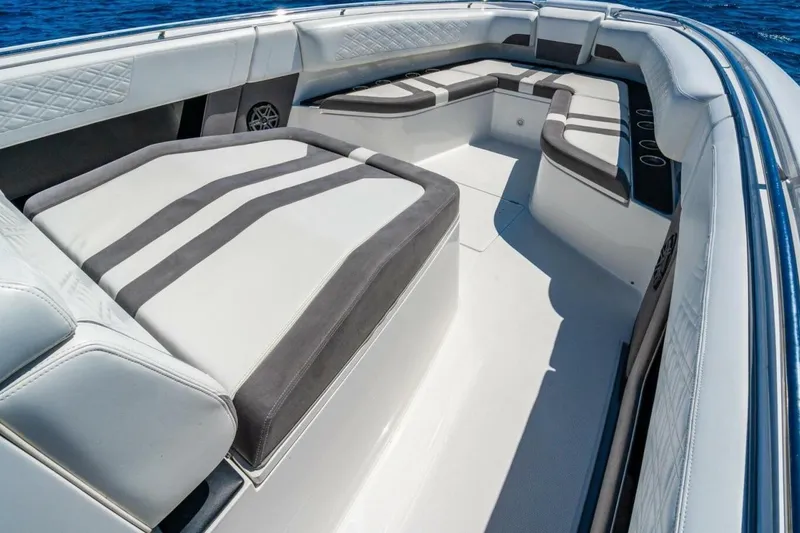 Slide: The Image of 2019 Cigarette 41' GTR boat interior with luxurious seating and sleek design on open water. - 24