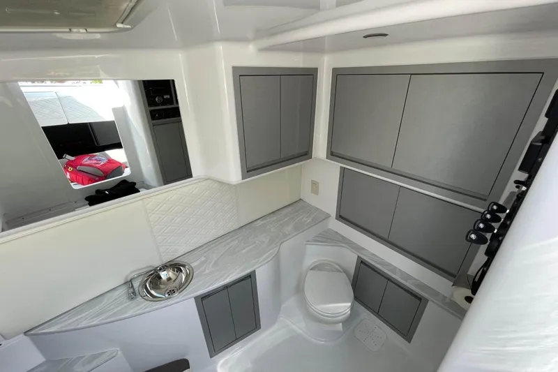 Slide: The Image of Luxurious interior of 2019 Cigarette 41' GTR boat featuring modern cabinetry and sleek design. - 27