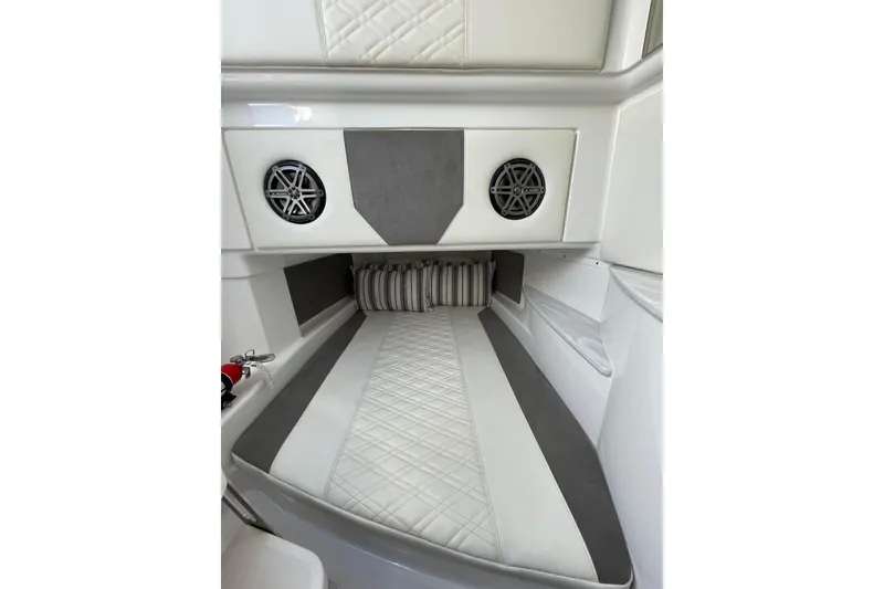 Slide: The Image of 2019 Cigarette 41' GTR cabin interior with quilted upholstery and built-in speakers. - 30