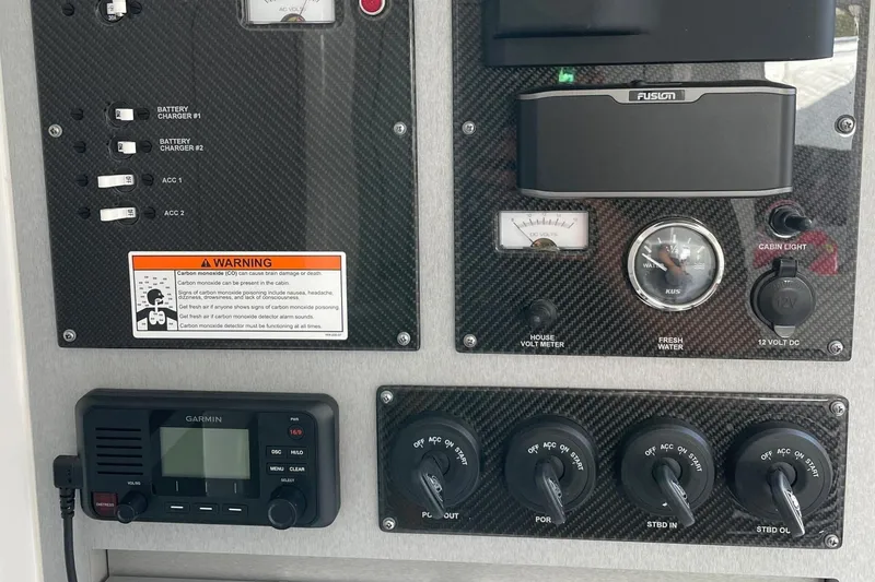 Slide: The Image of Control panel of a 2019 Cigarette 41' GTR boat with switches and gauges. - 31