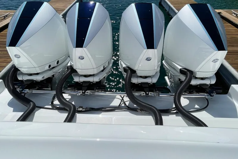 Slide: The Image of Four powerful outboard engines on a 2019 Cigarette 41' GTR boat at the dock. - 5