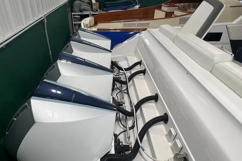 Slide: The Image of 2019 Cigarette 41' GTR boat with multiple outboard engines in a storage facility. - 6