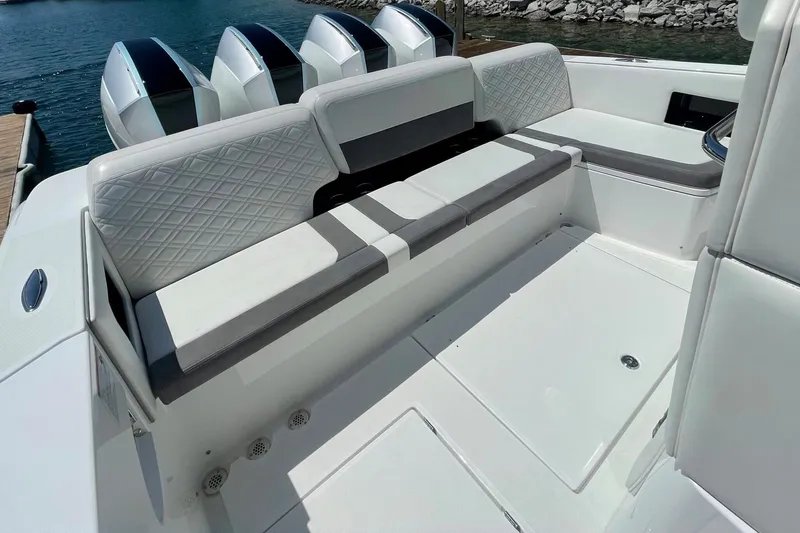Slide: The Image of 2019 Cigarette 41' GTR boat interior with cushioned seating and multiple outboard engines. - 9
