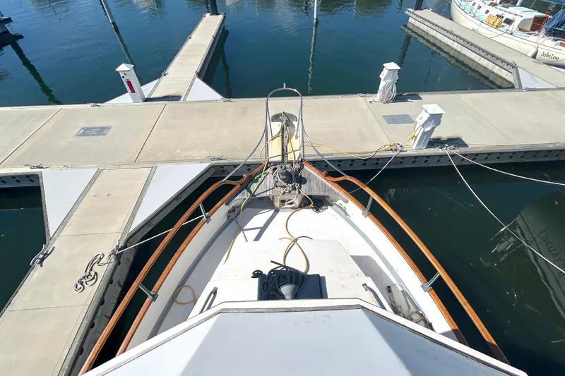 Slide: The Image of 1988 Grand Banks 36 Classic yacht docked at marina, viewed from above. - 17
