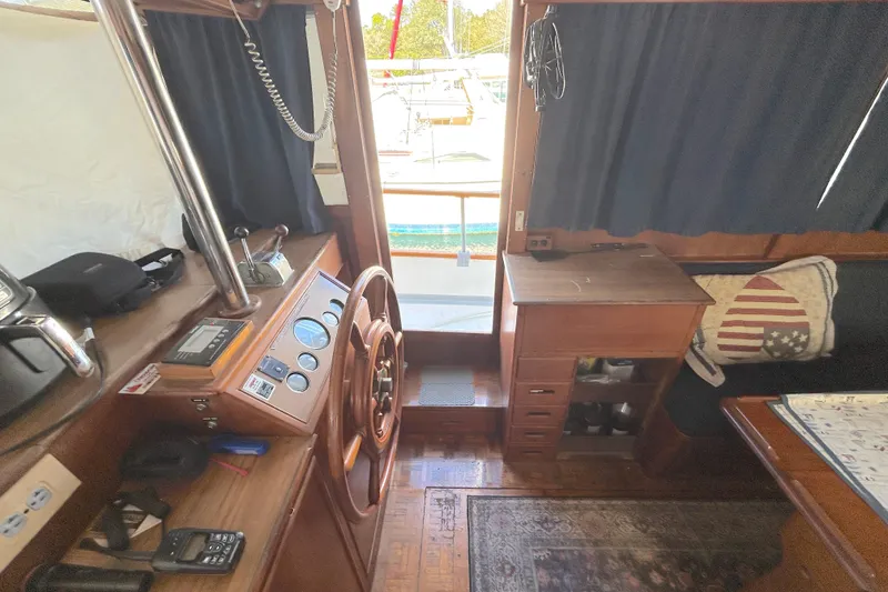 Slide: The Image of Interior of 1988 Grand Banks 36 Classic yacht with wooden helm and nautical decor. - 20