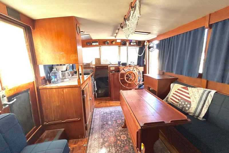 Slide: The Image of Interior of 1988 Grand Banks 36 Classic yacht with wooden furnishings and nautical decor. - 26