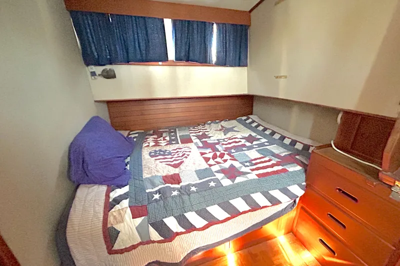 Slide: The Image of Cozy cabin bedroom in 1988 Grand Banks 36 Classic with quilted bedspread. - 31