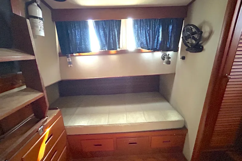 Slide: The Image of Cozy cabin interior of 1988 Grand Banks 36 Classic with bed and storage. - 33