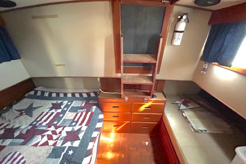 Slide: The Image of Cozy cabin interior of 1988 Grand Banks 36 Classic with star-patterned bedding. - 35