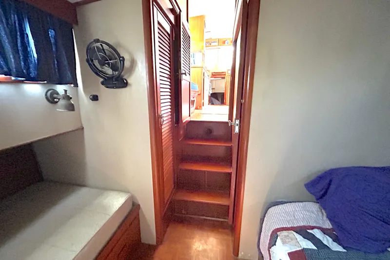 Slide: The Image of Interior of 1988 Grand Banks 36 Classic yacht with cozy cabin and wooden stairs. - 36