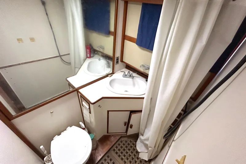 Slide: The Image of Bathroom interior of 1988 Grand Banks 36 Classic yacht, featuring sink and toilet. - 37