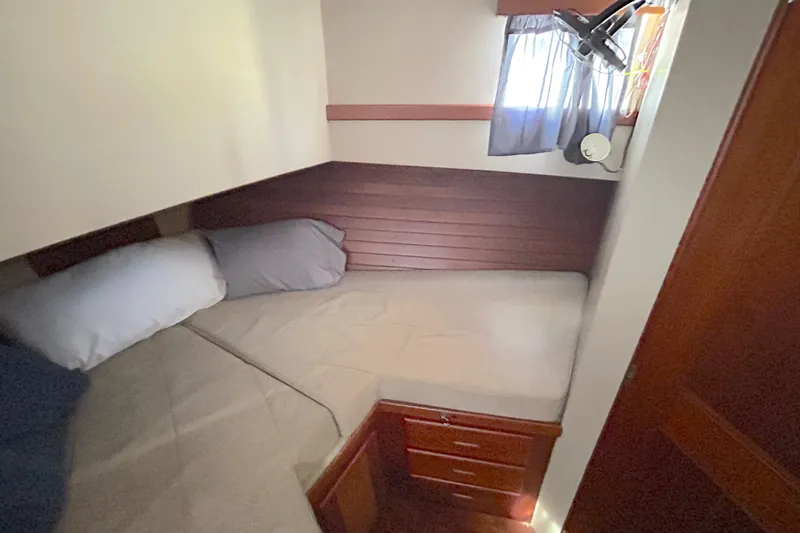 Slide: The Image of Cozy cabin interior of 1988 Grand Banks 36 Classic yacht with bed and window. - 39