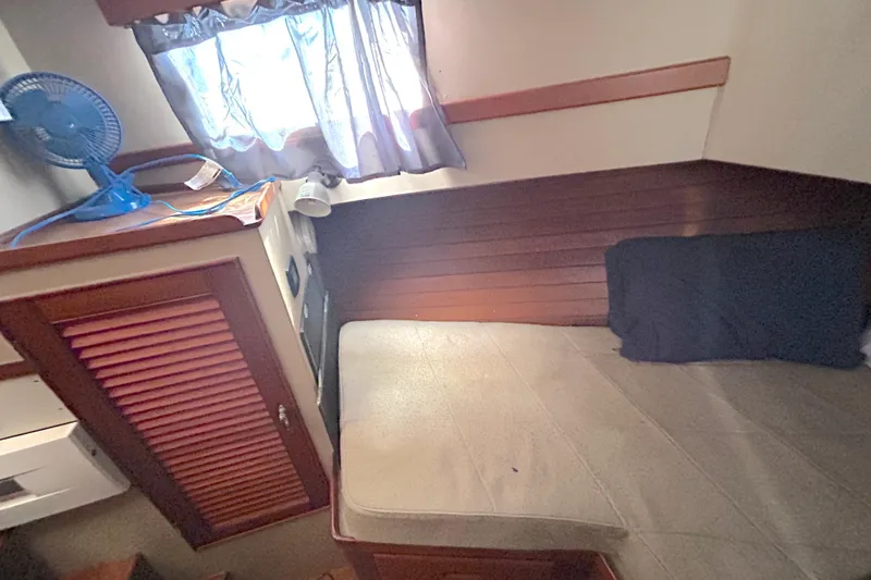 Slide: The Image of Cozy cabin interior of 1988 Grand Banks 36 Classic with bed and fan. - 40