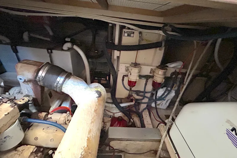 Slide: The Image of Engine room of 1988 Grand Banks 36 Classic, showcasing mechanical components and wiring. - 46
