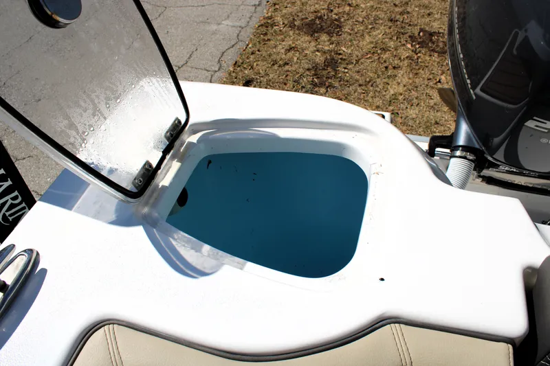 Slide: The Image of Open hatch on 2022 Tidewater 272 CC Adventure boat, showcasing interior compartment. - 11