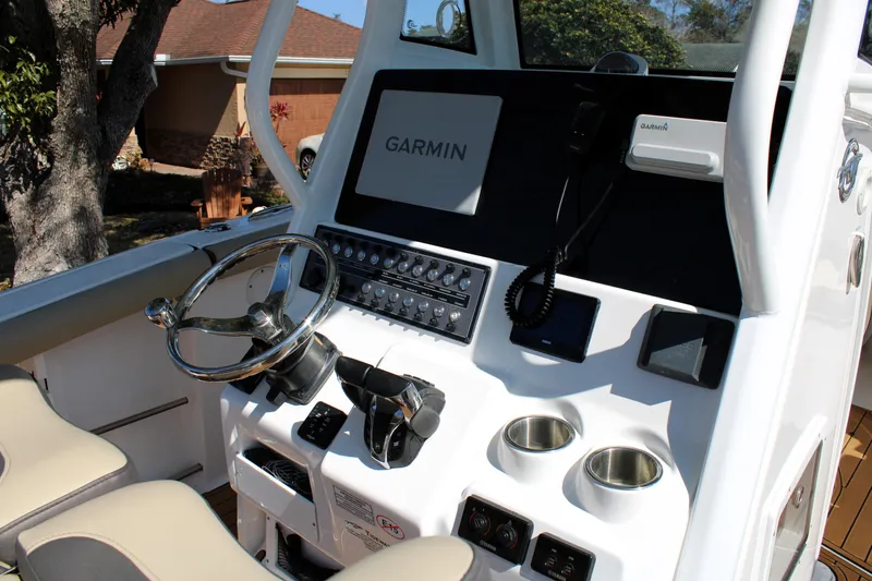 Slide: The Image of 2022 Tidewater 272 CC Adventure boat console with Garmin navigation system. - 20