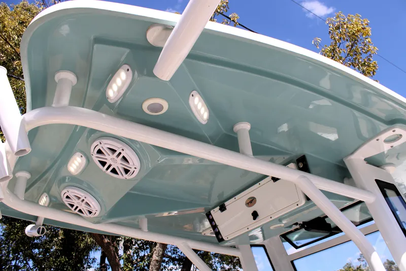 Slide: The Image of 2022 Tidewater 272 CC Adventure boat's T-top with speakers and lights. - 25