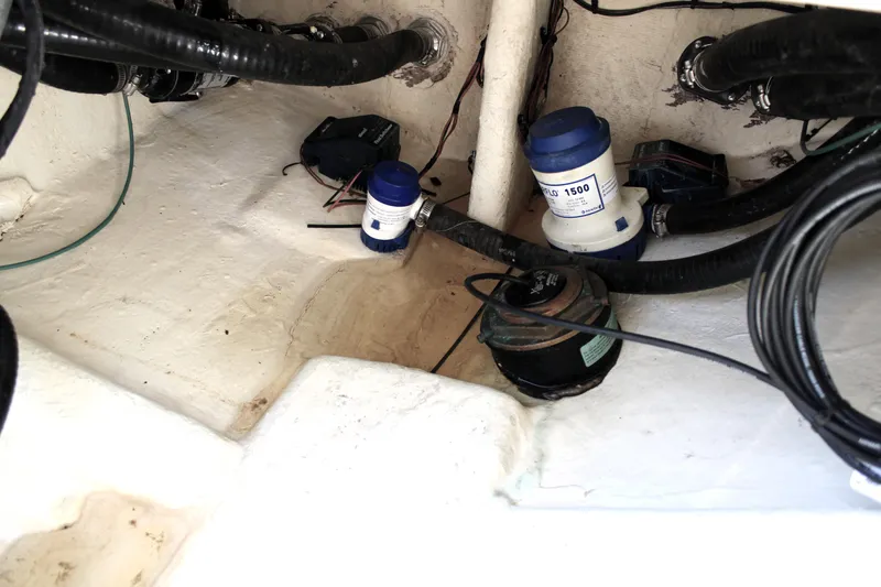 Slide: The Image of Bilge area of 2022 Tidewater 272 CC Adventure boat with pumps and wiring. - 27