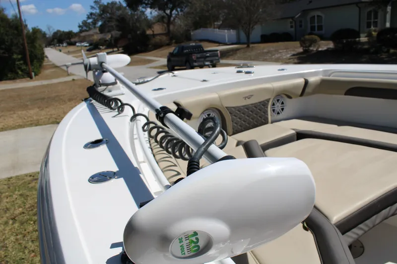 Slide: The Image of 2022 Tidewater 272 CC Adventure boat with trolling motor and cushioned seating. - 29