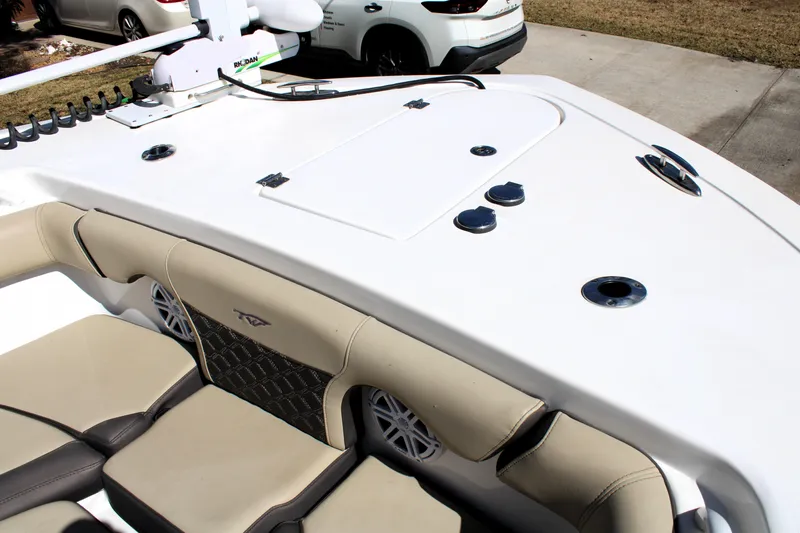 Slide: The Image of 2022 Tidewater 272 CC Adventure boat deck with seating and fishing rod holders. - 39