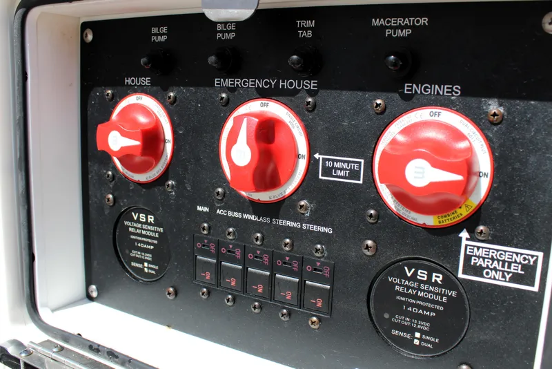 Slide: The Image of Control panel of 2022 Tidewater 272 CC Adventure boat with emergency switches and VSR modules. - 42