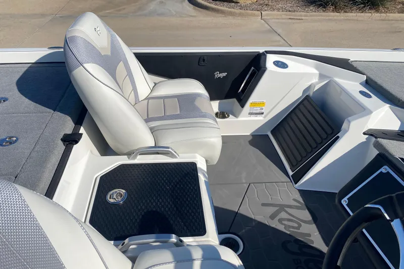Slide: The Image of 2026 Ranger Z520 boat interior with gray and white seating and sleek design. - 11