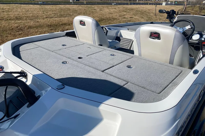 Slide: The Image of 2026 Ranger Z520 boat interior with cushioned seating and storage compartments. - 12