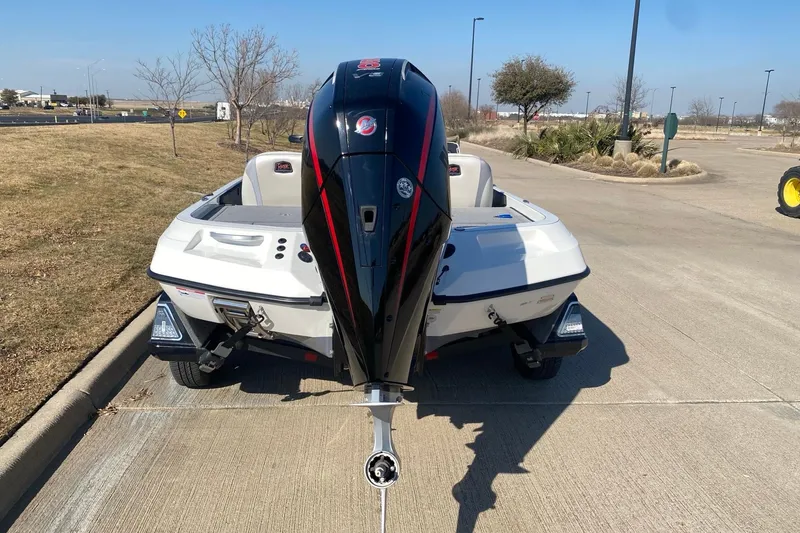 Slide: The Image of 2026 Ranger Z520 boat with powerful outboard motor on a sunny day. - 13