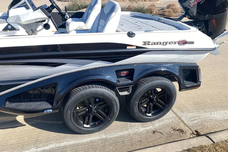 Slide: The Image of 2026 Ranger Z520 boat on trailer with sleek design and black wheels. - 14