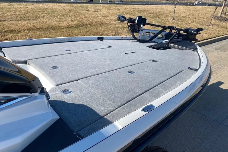 Slide: The Image of 2026 Ranger Z520 boat deck with carpeted surface and mounted equipment. - 7