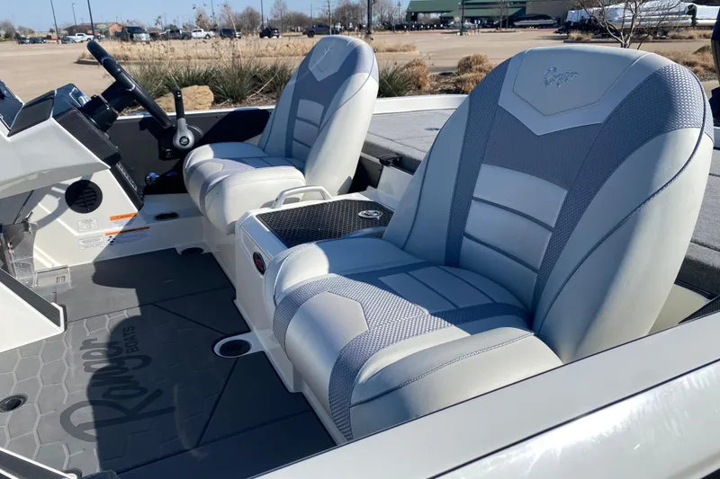 Slide: The Image of 2026 Ranger Z520 boat interior with modern seating and steering console. - 9