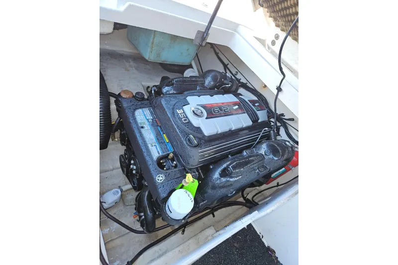 Slide: The Image of Engine compartment of a 2009 Searay 260 boat, featuring a 6.2L engine. - 10