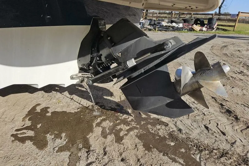 Slide: The Image of 2009 Searay 260 boat propeller and outdrive on sandy ground. - 4