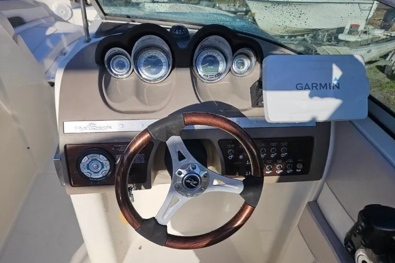 Slide: The Image of Dashboard of a 2009 Searay 260 boat with Garmin navigation system. - 8