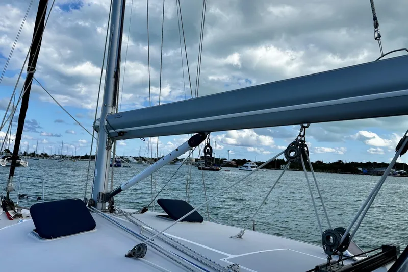 Slide: The Image of Sailboat deck view of 2005 Catalina Morgan 440, with marina and cloudy sky background. - 2