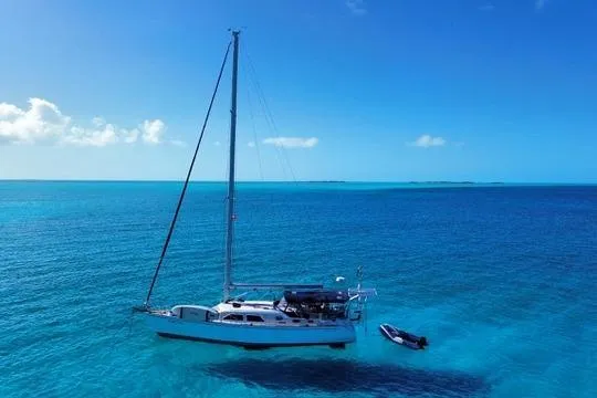 Slide: The Image of Sailboat Catalina Morgan 440 (2005) anchored in clear blue ocean waters. - 20