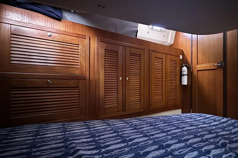 Slide: The Image of Cozy cabin interior of 2005 Catalina Morgan 440 sailboat with wooden cabinetry. - 39