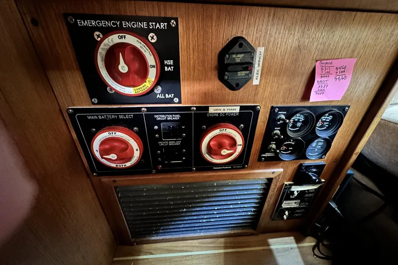 Slide: The Image of Control panel of a 2005 Catalina Morgan 440 sailboat with emergency engine start and battery selectors. - 46