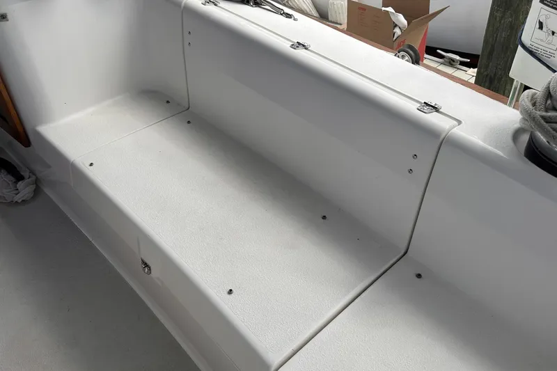 Slide: The Image of White seating area on a 2005 Catalina Morgan 440 sailboat deck. - 53