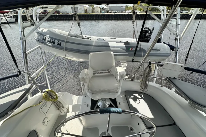 Slide: The Image of Cockpit view of 2005 Catalina Morgan 440 sailboat with dinghy on davits. - 59