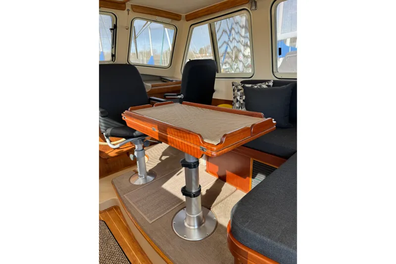 Slide: The Image of 2008 Island Packet SP Cruiser interior with adjustable table and seating. - 14