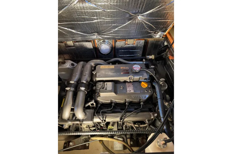 Slide: The Image of Engine compartment of a 2008 Island Packet SP Cruiser, showcasing detailed mechanical components. - 17