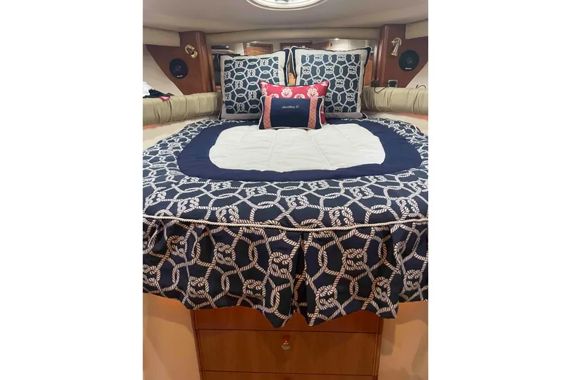 Slide: The Image of Luxurious bedroom in 2003 Meridian 411 Sedan yacht with nautical-themed bedding. - 12