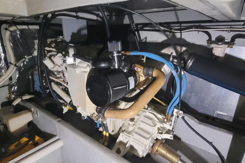 Slide: The Image of Engine room of a 2003 Meridian 411 Sedan, showcasing mechanical components and wiring. - 16