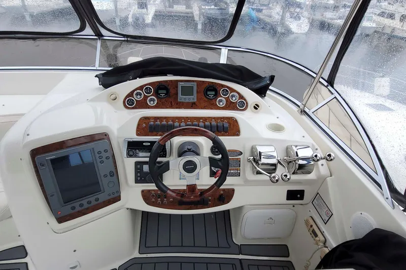 Slide: The Image of Cockpit of 2003 Meridian 411 Sedan with steering wheel and navigation controls. - 2