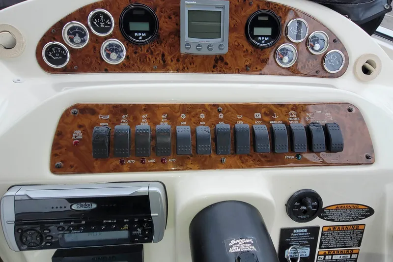 Slide: The Image of Control panel of a 2003 Meridian 411 Sedan boat with gauges and switches. - 3